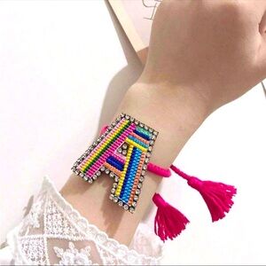 Pink Beaded Bracelet with Letter A in Geometric Pattern and Tassel